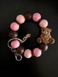 Chocolate brown and pink bear